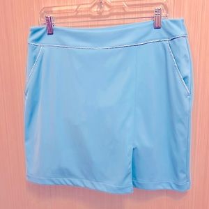 Greg Norman Sky blue skort with mini-pleat. Size M. Pretty cord trim.